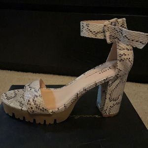 Worn once. Brown snake skin open toed heals